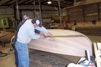 The waterline is scribed and the interior and exterior of the hull are primed with paint.