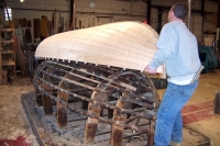 The hull is lifted off the mold.