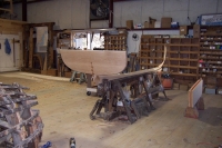 The keel is steam bent on the jig with the skeg, transom, and centerboard box added to make up the backbone.